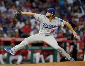  ?? LUIS SINCO/TRIBUNE NEWS SERVICE ?? Dodgers ace Clayton Kershaw, bothered by back stiffness, is missing the first two stops of Los Angeles’s road trip.
