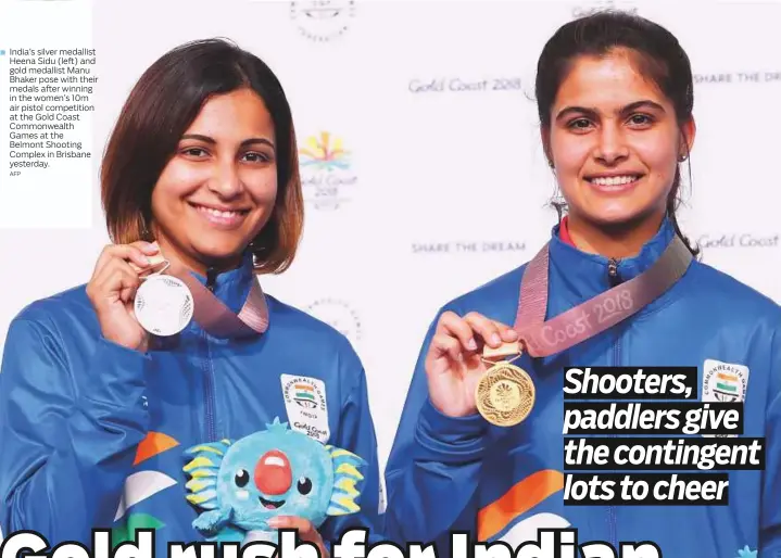  ?? AFP ?? India’s silver medallist Heena Sidu (left) and gold medallist Manu Bhaker pose with their medals after winning in the women’s 10m air pistol competitio­n at the Gold Coast Commonweal­th Games at the Belmont Shooting Complex in Brisbane yesterday.