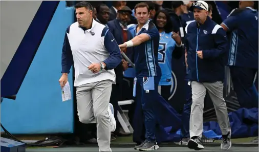  ?? MARK ZALESKI — THE ASSOCIATED PRESS ?? Tennessee Titans head coach Mike Vrabel runs onto the field before a game against the Cincinnati Bengals Sunday in Nashville, Tenn.