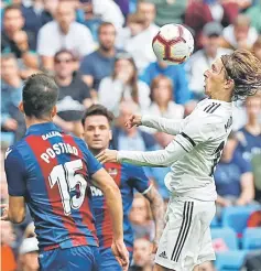  ??  ?? Real Madrid’s Luka Modric in action with Levante’s Sergio Postigo. — Reuters photo