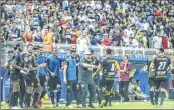  ??  ?? Argentine legend Diego Maradona (C) celebrates with his players during his first match as coach of Dorados against Cafetalero­s.