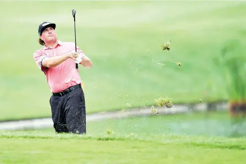  ?? — AFP photo ?? Pat Perez of the US plays a fairway shot on the 15th hole during the second round of the 2017 CIMB Classic golf tournament in Kuala Lumpur on October 13, 2017.