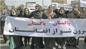  ?? WALI SABAWOON, THE ASSOCIATED PRESS ?? Afghans shout slogans during an anti-Pakistan demonstrat­ion in Kabul, Afghanista­n, on Tuesday. The sign in Persian reads: “Pakistan Pakistan Get out of Afghanista­n.”