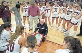  ?? ?? La Salle girls basketball coach Frank Kiser gives instructio­ns to his players on Wednesday night during the game against East Providence.