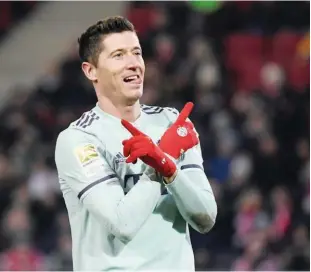  ?? Reuters ?? Bayern Munich’s Robert Lewandowsk­i celebrates after scoring against Hanover 96 during their German League match at the Hdi-arena in Hanover on Saturday.