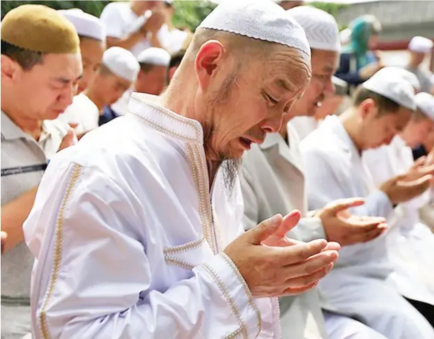  ??  ?? Muslims pray at the Niujie Mosque to celebrate Eid al-Fitr in Beijing, China (File Photo)