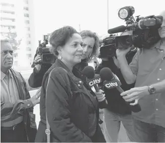  ?? Tyler Anderson/Postmedia News ?? Family members of Reyal Jardine-Douglas talk to the media as they line up to enter the coroner’s court at the beginning of an inquest into the deaths of Jardine-Douglas, Sylvia Klibingait­is and Michael Eligon.