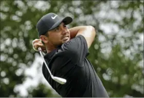  ?? CHUCK BURTON — THE ASSOCIATED PRESS ?? Jason Day watches his tee shot on the sixth hole during the third round of the Wells Fargo Championsh­ip golf tournament at Quail Hollow Club in Charlotte, N.C., Saturday.