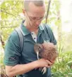  ?? Photo: DOC ?? Safe hands: DOC team leader biodiversi­ty Neil Freer with a Haast tokoeka before it is translocat­ed to the Orokonui Ecosanctua­ry.