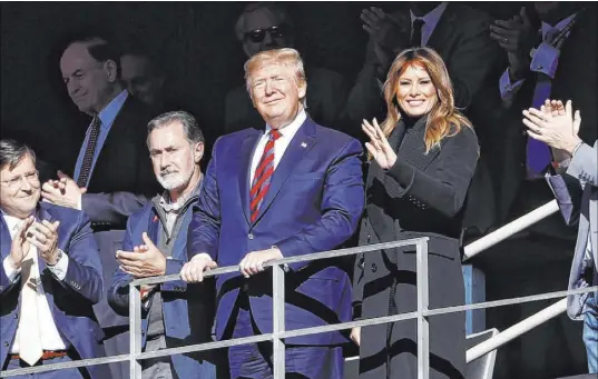  ?? John Bazemore The Associated Press ?? President Donald Trump and his wife, Melania, watch the Alabama-LSU football game Saturday in Tuscaloosa, Ala.