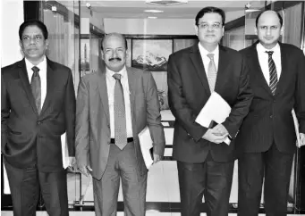  ?? PHOTO: KAMLESH PEDNEKAR ?? RBI Governor Urjit Patel ( second from right) with ( from left) Deputy Governors B P Kanungo, N S Vishwanath­an, and Viral V Acharya, after announcing the monetary policy in Mumbai on Wednesday