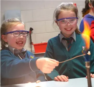  ??  ?? Adam McMullen Murtagh had Katie Carberry as a tour guide in Ardee CS. Right: Primary school children visiting Ardee Community School.