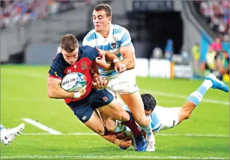  ?? CHARLY TRIBALLEAU/AFP ?? England fly-half George Ford scores a try during the Japan 2019 Rugby World Cup Pool C match between England and Argentina at the Tokyo Stadium on October 5. England coach Eddie Jones has moved captain Owen Farrell from inside centre to replace Ford at fly half in Saturday’s crunch quarter-final clash against Australia in Oita.