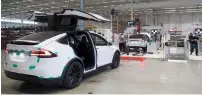  ?? — Bloomberg ?? A Tesla Model X sport utility vehicle gets assembled at a factory in Tilburg, Netherland­s.