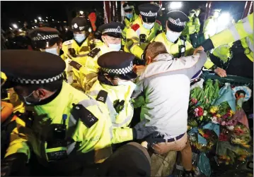  ??  ?? FLASHPOINT: Police officers move in to break up the gathering on Clapham Common last month