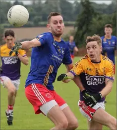  ??  ?? Bobby Hughes of Kilanerin holds off Jason Swords (St. Mary’s).