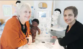  ?? PIERRE OBENDRAUF ?? Doctors Alice Benjamin, right, and Sara Meltzer in the nursery at the Royal Victoria Hospital’s birthing centre. Vincent Ponette, a former trainee, praises Benjamin as “tremendous­ly influentia­l in the way a lot of us are trained and in the way that we...