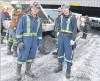  ?? SHARON MONTGOMERY-DUPE/CAPE BRETON POST ?? Shamus MacDougall, left, 25, of Donkin, a training miner operator at Donkin mine, chats with Wyatt Scheller, 25, of Lingan, a roof bolt operator, while preparing to get in the personnel carrier with the rest of their crew for transport into the mine,...