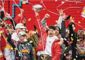  ?? Reed Hoffmann/Associated Press ?? Chiefs quarterbac­k Patrick Mahomes and teammates celebrate Wednesday during the team’s victory celebratio­n and parade in downtown Kansas City, Mo.