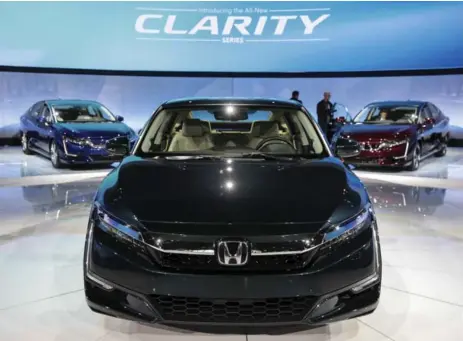  ?? DREW ANGERER/GETTY IMAGES ?? Honda began leasing its Clarity fuel cell sedan this year. Fuel cell cars refuel as quickly as gasoline-powered cars.