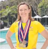  ??  ?? Julie McDonald with some of her medals.