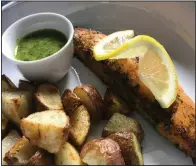  ?? (Arkansas Democrat-Gazette/Kelly Brant) ?? Salmon With Chimichurr­i and Roasted Potatoes