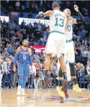  ??  ?? The Celtics’ Marcus Morris (13) and Jayson Tatum (0) both scored 3-point shots in a 40-point third quarter that lifted Boston over the Thunder in Oklahoma City on Thursday. [PHOTO BY BRYAN TERRY, THE OKLAHOMAN]