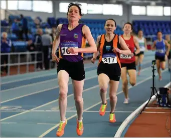  ??  ?? Anne Gilshinan (Slaney Olympic) on her way to victory in the Over-50 800m in Athlone.