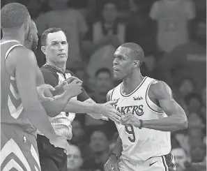  ?? JAYNE KAMIN-ONCEA/USA TODAY SPORTS ?? Lakers guard Rajon Rondo throws a punch at Rockets guard Chris Paul. Rondo was one of three punished by the NBA, but he is being applauded by fans in Los Angeles.