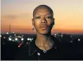  ?? Picture: Alon Skuy ?? ‘Inxeba (The Wound)’ star Nakhane on a Johannesbu­rg rooftop.