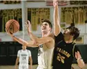  ?? RICK KINTZEL/THE MORNING CALL ?? Allentown Central Catholic’s Griffen Patridge drives against Freedom’s Nicholas Ellis Friday during an Eastern Pennsylvan­ia Conference boys quarterfin­al at Rockne Hall.