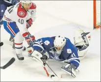  ?? KEVIN HIGGINGS/THE BEACON ?? The St. John’s IceCaps’ Gabriel Dumont tries to corral a puck to put it past a sprawling to out deke a sprawling Ryan Massa of the Toronto Marlies in Game 3 of the team’s Colemans Cup American Hockey League exhibition series Sunday at the Gander...