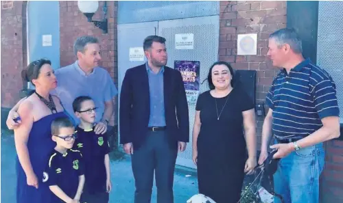  ??  ?? Southport MP Damien Moore, centre, meets campaigner­s who want to save the Blundell Arms for community use