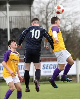  ??  ?? Wexford’s Kyle Firman gets his head to the ball ahead of Adam Duffy.