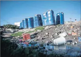  ?? Photo: David Harrison ?? Half-baked: Portable toilets in an informal settlement. ‘They’ promised so much but delivery was inadequate.