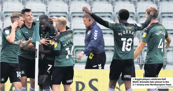  ?? Dave Rowntree/PPAUK ?? Argyle players celebrate Kell Watts’ dramatic late winner in the 2-1 victory over Northampto­n Town