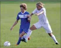  ?? STAN HUDY/THE SARATOGIAN ?? Bethlehem Central’s Salko Kanic (right) locks up with Saratoga Springs sophomore Joe Radovic during the second half of of Tuesday’s Suburban Councol contest at Saratoga Springs High School.