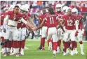  ?? MICHAEL CHOW/THE REPUBLIC ?? Cardinals wide receiver Larry Fitzgerald (11) runs onto the field before playing against the Browns.