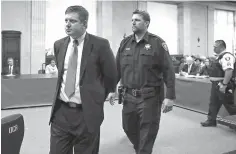  ?? Antonio Perez/ Chicago Tribune via AP, Pool ?? Chicago police Officer Jason Van Dyke, left, is taken into custody Friday at the Leighton Criminal Court Building in Chicago after jurors found him guilty of second-degree murder and aggravated battery. top left