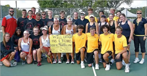  ?? SHELLEY WILLIAMS SPECIAL TO THE ENTERPRISE-LEADER ?? Prior to Thursday’s tennis matches, players and coaches from Farmington and Prairie Grove gathered to show support for Prairie Grove senior Will Luther, a former Farmington student, who was injured by a baseball accident and didn’t compete against his old school.