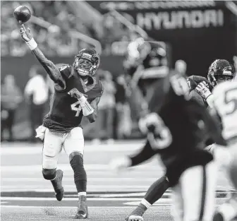  ??  ?? Texans quarterbac­k Deshaun Watson throws a pass to wide receiver Braxton Miller during the first quarter. Watson completed 5 of 8 passes for 73 yards, one touchdown and no intercepti­ons.