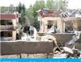  ?? — AFP ?? KABUL: Afghan security forces investigat­e the site where a Taleban car bomb detonated at the entrance of a police station in Kabul yesterday.
