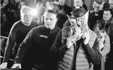  ?? — Reuters photos ?? Suspects appear in a regional court in Berlin, Germany accused of the 2017 theft of a 100 kg ‘Big Maple Leaf gold coin.