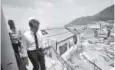  ?? Christophe Ena, The Associated Press ?? France’s President Emmanuel Macron last week walks down a destroyed building during his visit in the French Caribbean islands of St. Martin.