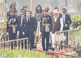  ?? — AFP photo ?? Macron (front, left), with India’s President Droupadi Murmu (front centre) and Modi (second right) leaving after attending India’s 75th Republic Day parade in New Delhi.