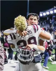  ?? ?? Jack McCall and Braden Williams celebrate after the Cougars’ win over Cy-Fair on Friday night.