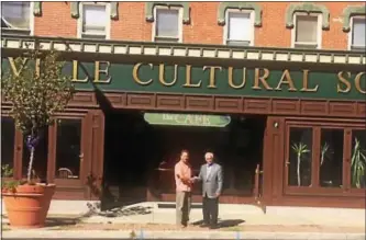  ?? SUBMITTED PHOTO ?? Developer Jim DePetris and Danny Fruchter, head of the Coatesvill­e Cultural Society, stand in front of the building.