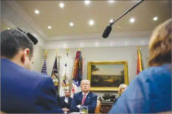  ?? AP PHOTO ?? President Donald Trump listens during a meeting with state and local officials to discuss school safety in the Roosevelt Room of the White House.