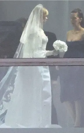  ?? ?? Lovely in lace: The bride wore a bespoke gown, gloves and full veil