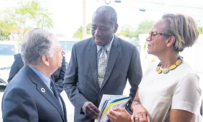  ?? CONTRIBUTE­D ?? Permanent Secretary in the Ministry of Transport and Mining Dr Alwin Hales (centre) in discussion with Convener, United Nations Secretary General’s Special Envoy for Road Safety, Jean Todt (left), and General Manager, Caribbean Country Department and Country Representa­tive for Jamaica, Inter-American Developmen­t Bank, Therese Turner-Jones. Occasion was the inaugural Caribbean Road Safety Workshop in Jamaica held at the Inter-American Developmen­t Bank in St Andrew on Thursday.